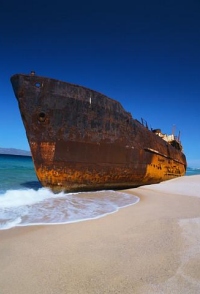 photograph of a ship on a beach